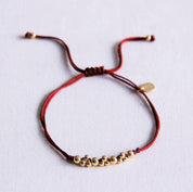 Bazou Bracciale in raso con perline color oro - bordeaux