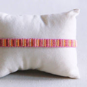 Bazou Bracciale intrecciato a righe - rosa/arancione