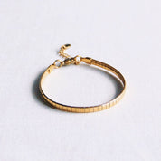Bazou Bracciale piatto in acciaio a righe - oro
