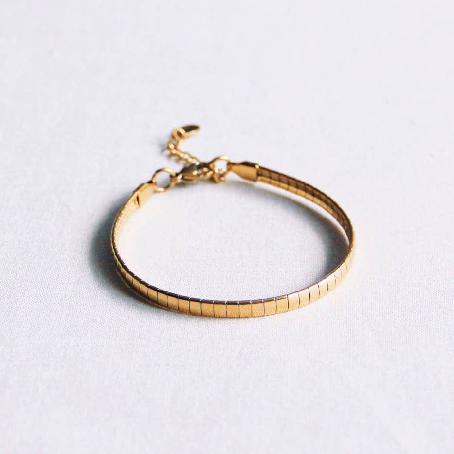 Bazou Bracciale piatto in acciaio a righe - oro