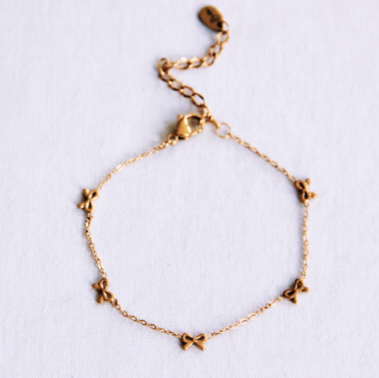 Bazou Bracciale delicato con fiocchi - oro
