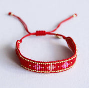 Bazou Braccialetto intrecciato con motivo floreale - rosso/rosa