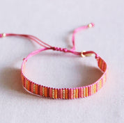 Bazou Bracciale intrecciato a righe - rosa/arancione