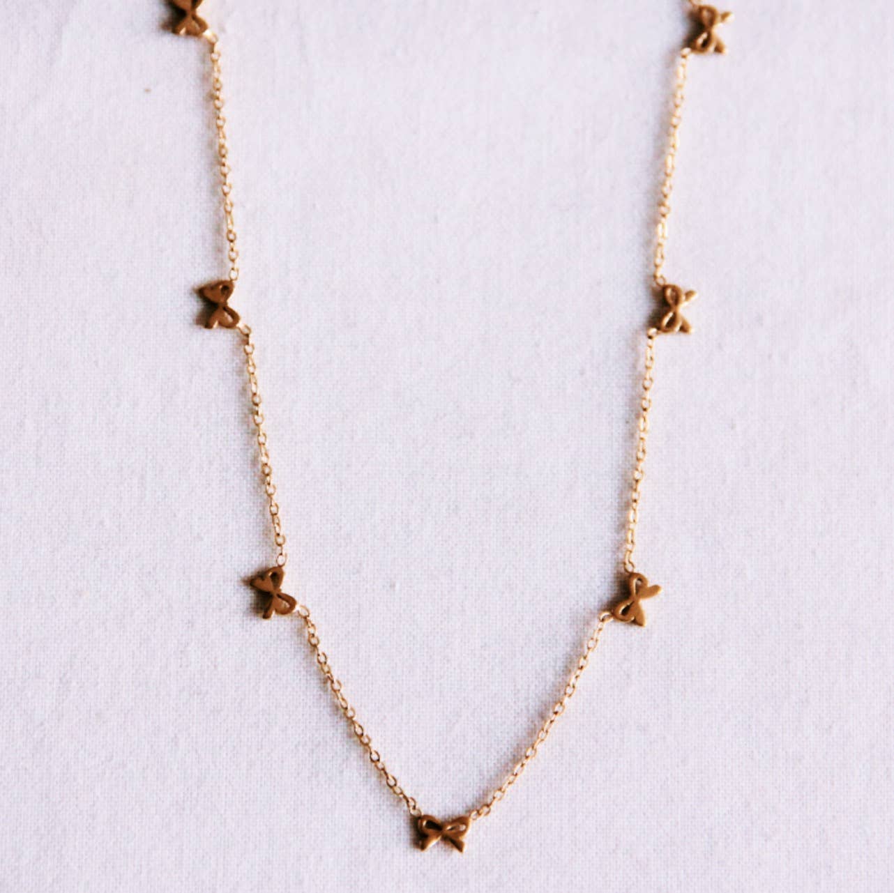 Bazou Collana delicata con fiocchi - oro