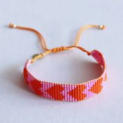 Bazou Braccialetto intrecciato con cuori - rosa/arancione