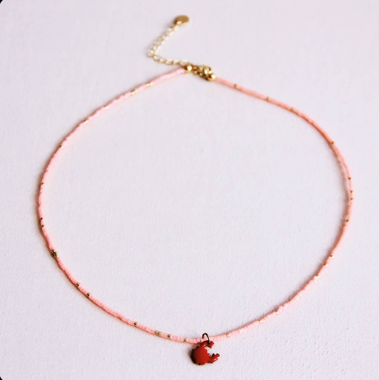 Bazou Collana con perline e granchio - rosa acceso