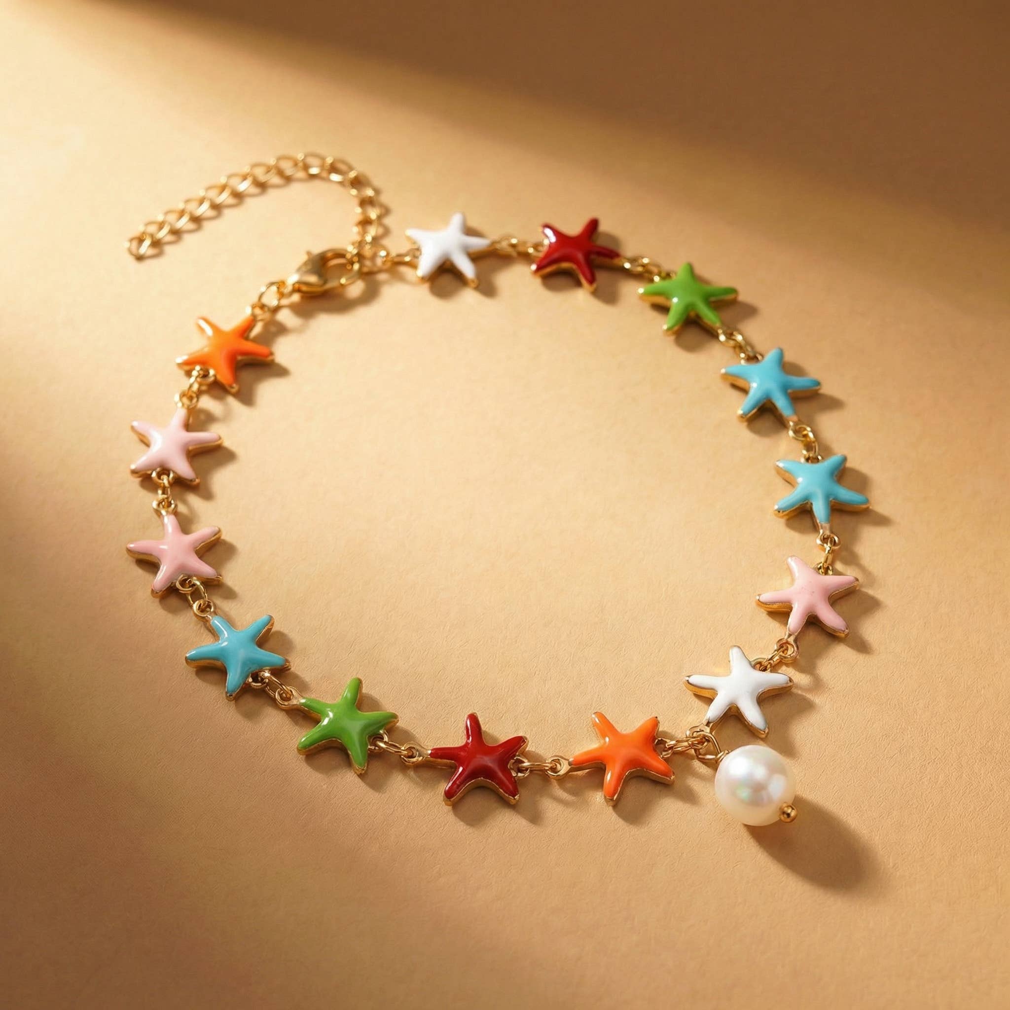 Goupi Lab Cavigliera con stella marina colorata e pendente di perla