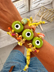 Goupi Lab Bracciale bandana giallo regolabile con occhio verde in vetro